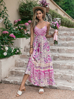 Pink floral print viscose maxi dress with drawstring waist and tassels.
