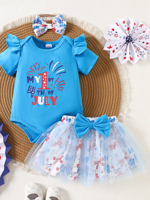 Blue cotton baby outfit with ruffled sleeves and "My 1st 4th of July" graphic, paired with a bow-adorned tutu skirt.