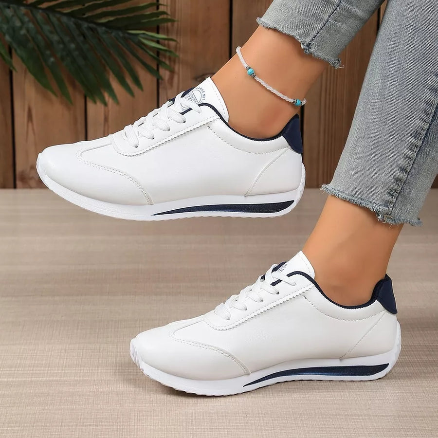 Dark Blue sneakers featuring lace-up closure and color-block