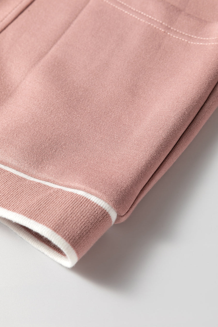 Dusty pink cocoon cardigan with white varsity trim detail