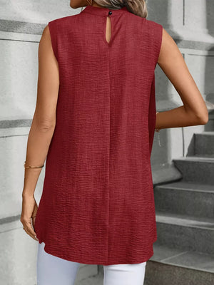 Wine red sleeveless mock neck tank top with textured fabric and back button closure.