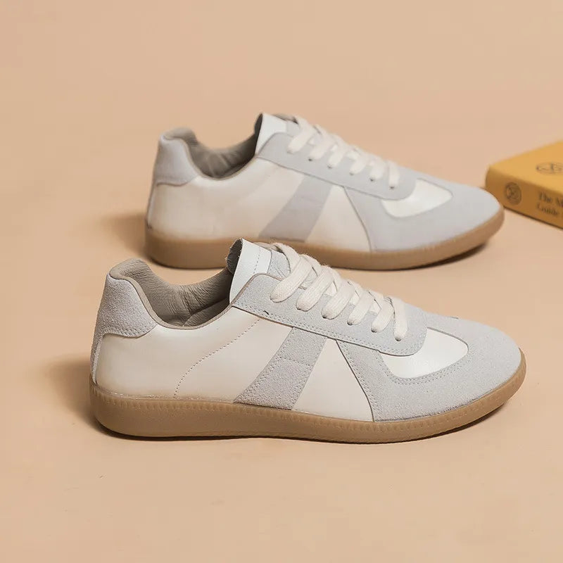 Retro panel leather sneakers in beige and white with suede accents and gum soles.