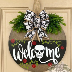 white door hanger featuring skull graphic and skull-print
