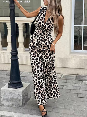 Chic sleeveless leopard print romper with V-neck and belted waist.