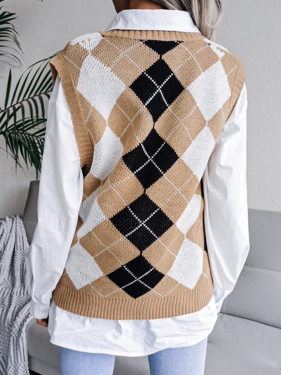 Argyle knit sweater vest in tan, black, and white acrylic, styled over a white shirt.
