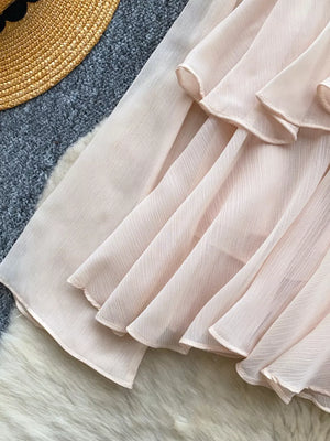 Pink chiffon tiered blouse with ruffled details