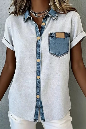 Light gray short sleeve button-down overshirt with denim collar, placket, and pocket.