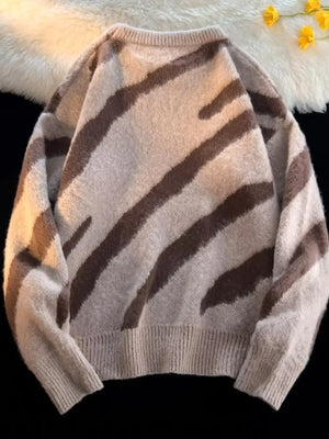 Oversized fuzzy knit pullover sweater in khaki with brown abstract stripes.