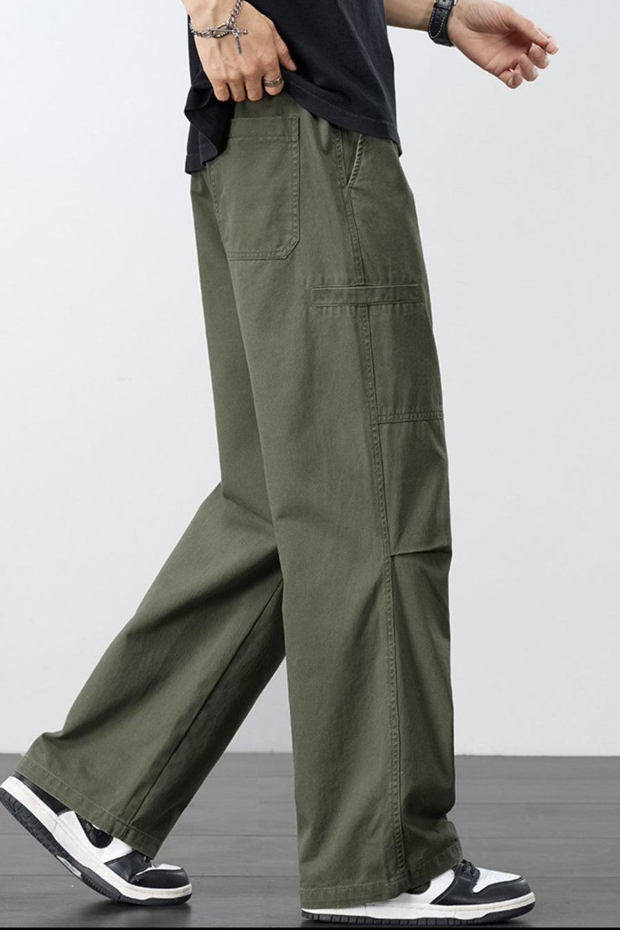 Army green cargo pants with adjustable drawstring and multiple pockets.