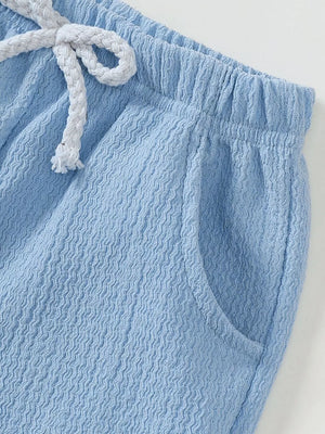 Blue ribbed baby shorts with elastic waist and drawstring detail