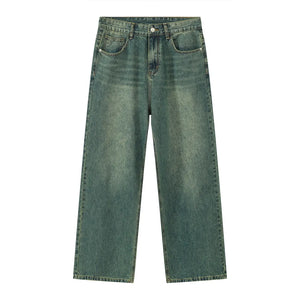 Wide-leg denim trousers in a faded green wash with a relaxed fit.