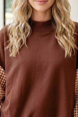 tan sweatshirt featuring ribbed cuffs and color-block