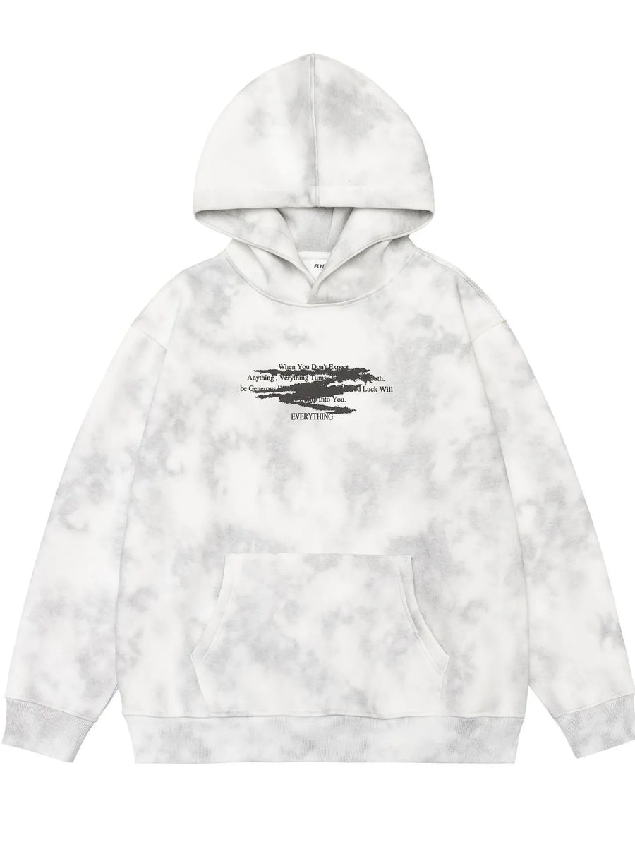 Oversized tie-dye hoodie in Cement Gray with graphic text and front pocket.