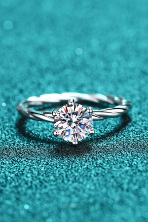 Silver twisted band ring with a round moissanite solitaire diamond.