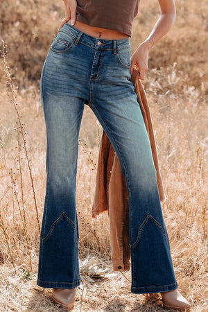 flare jeans in medium wash blue featuring pocketed and flared fit