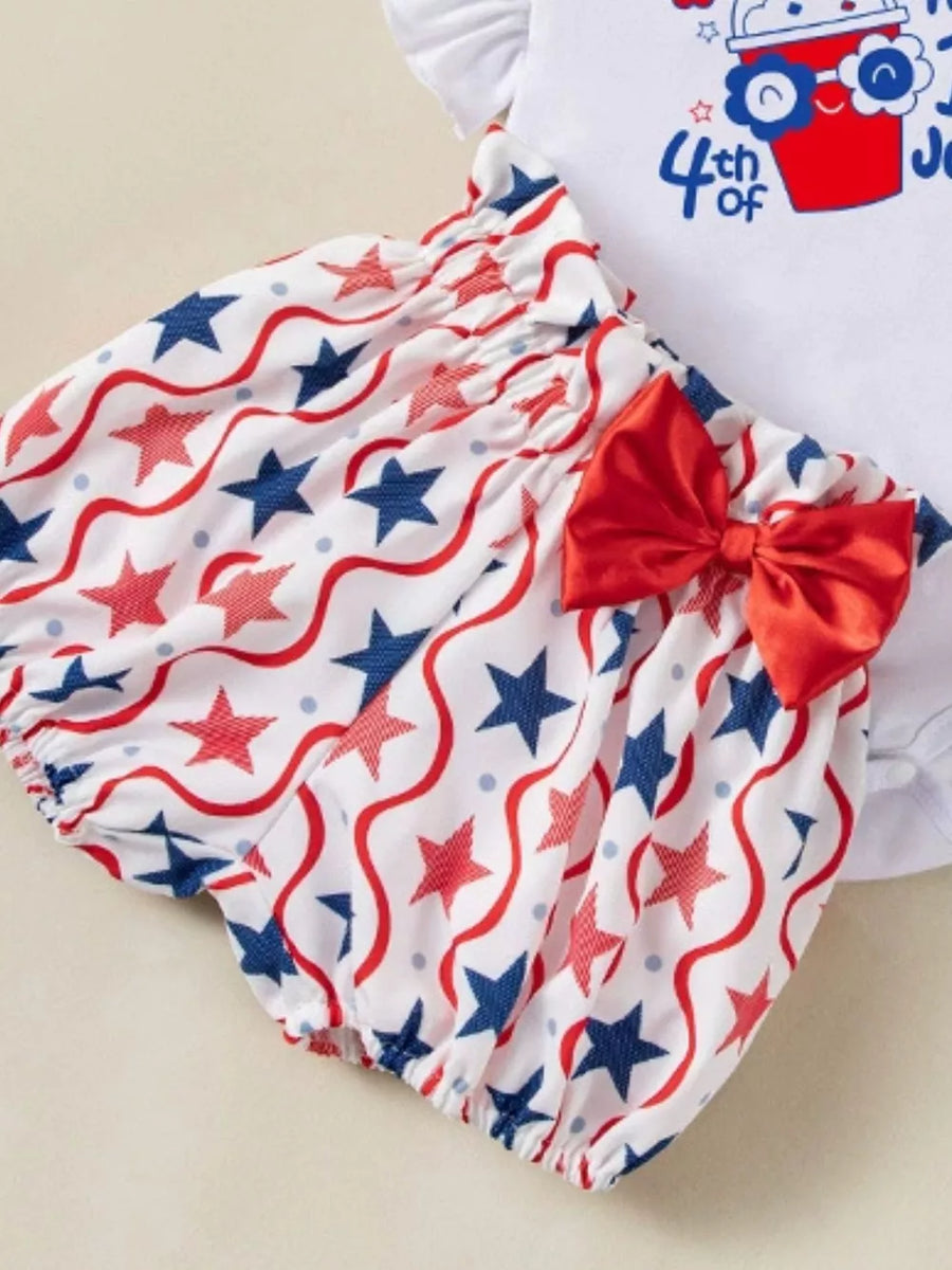 Baby outfit set with red, white, and blue star pattern bloomers and a red bow.