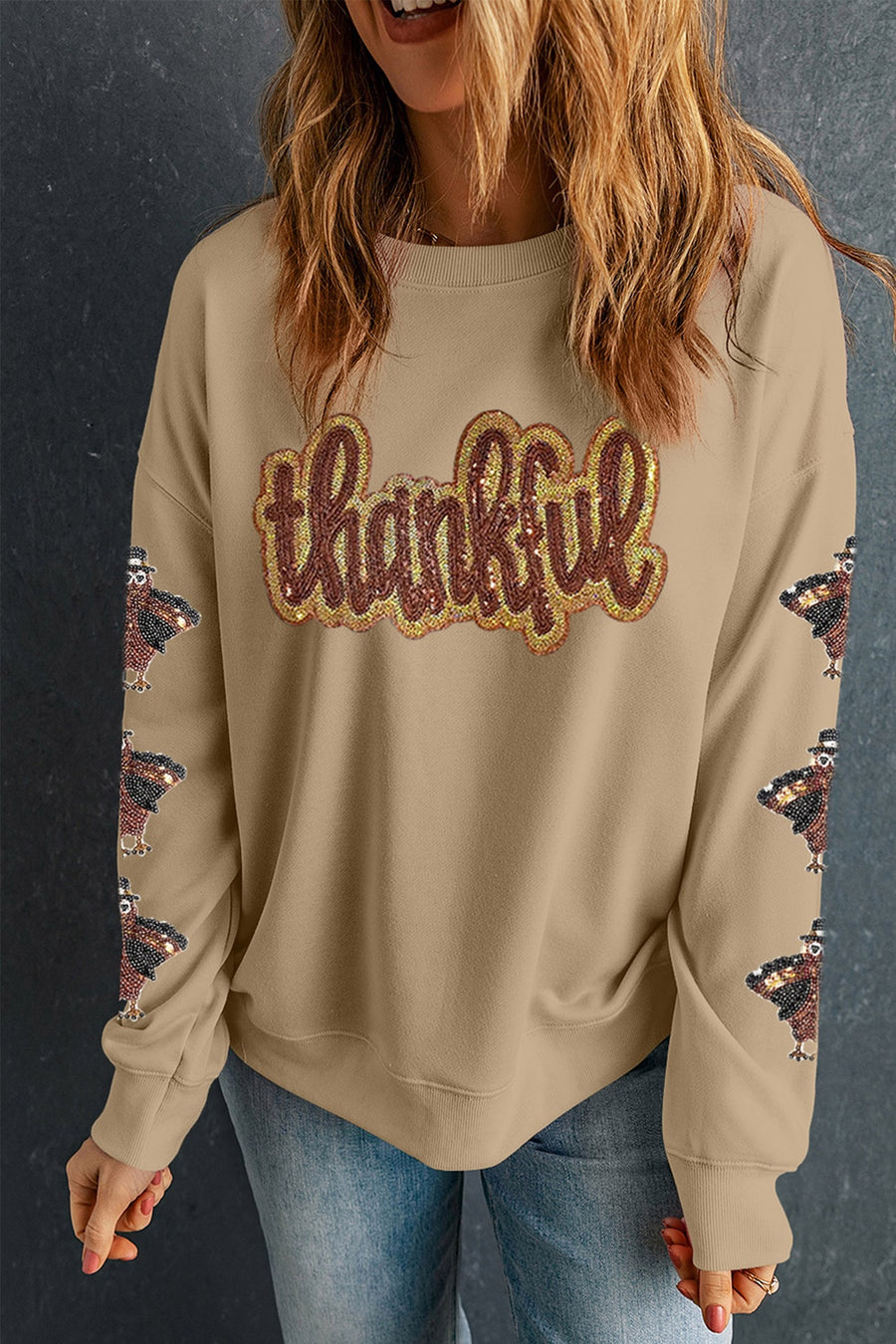 50% polyester, 50% cotton Care instructions: Machine wash cold sweatshirt in brown with relaxed silhouette