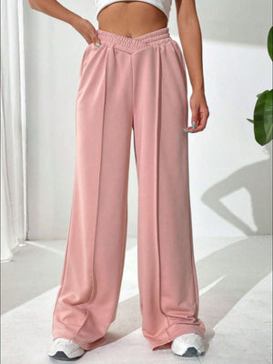 Blush pink palazzo sweatpants with V-waistline and center seams