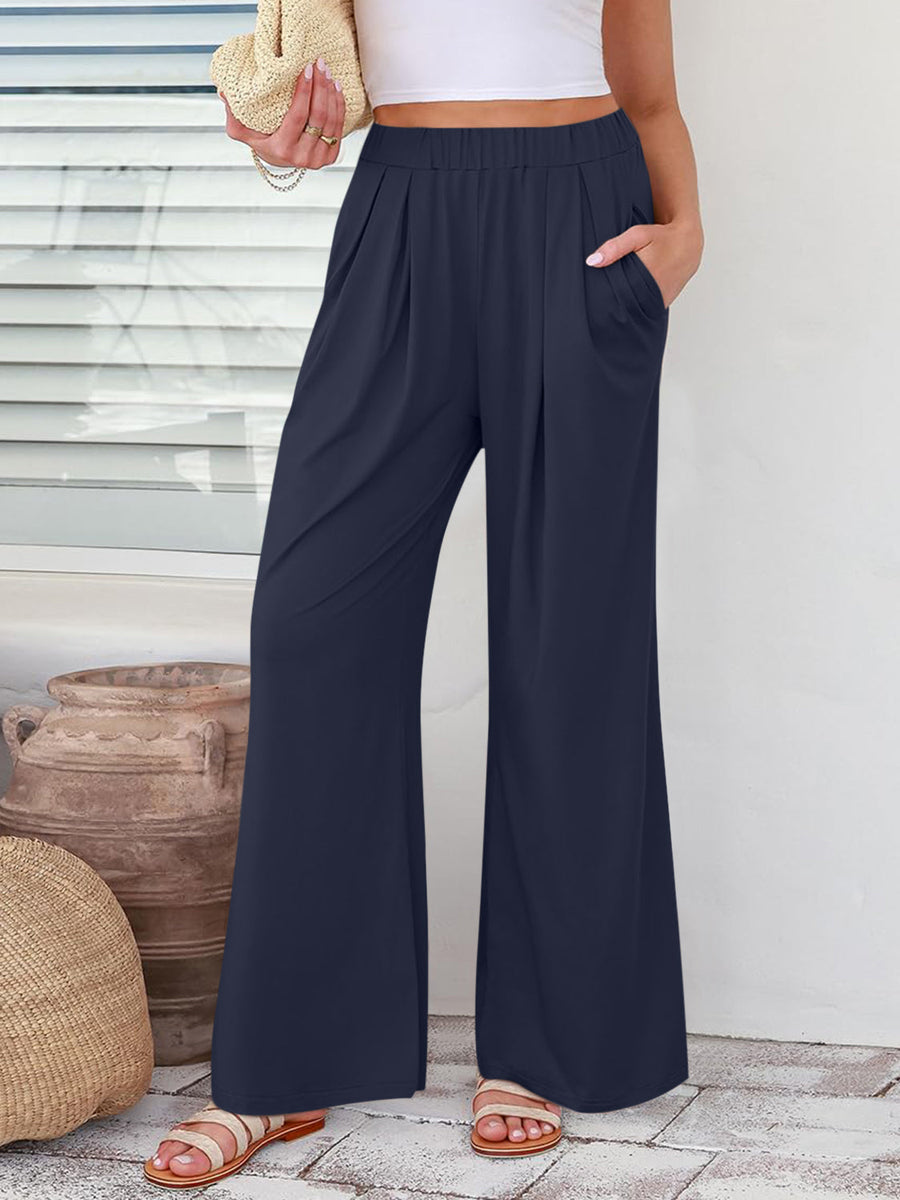 Pleated palazzo trousers in dark blue with pockets and a wide leg