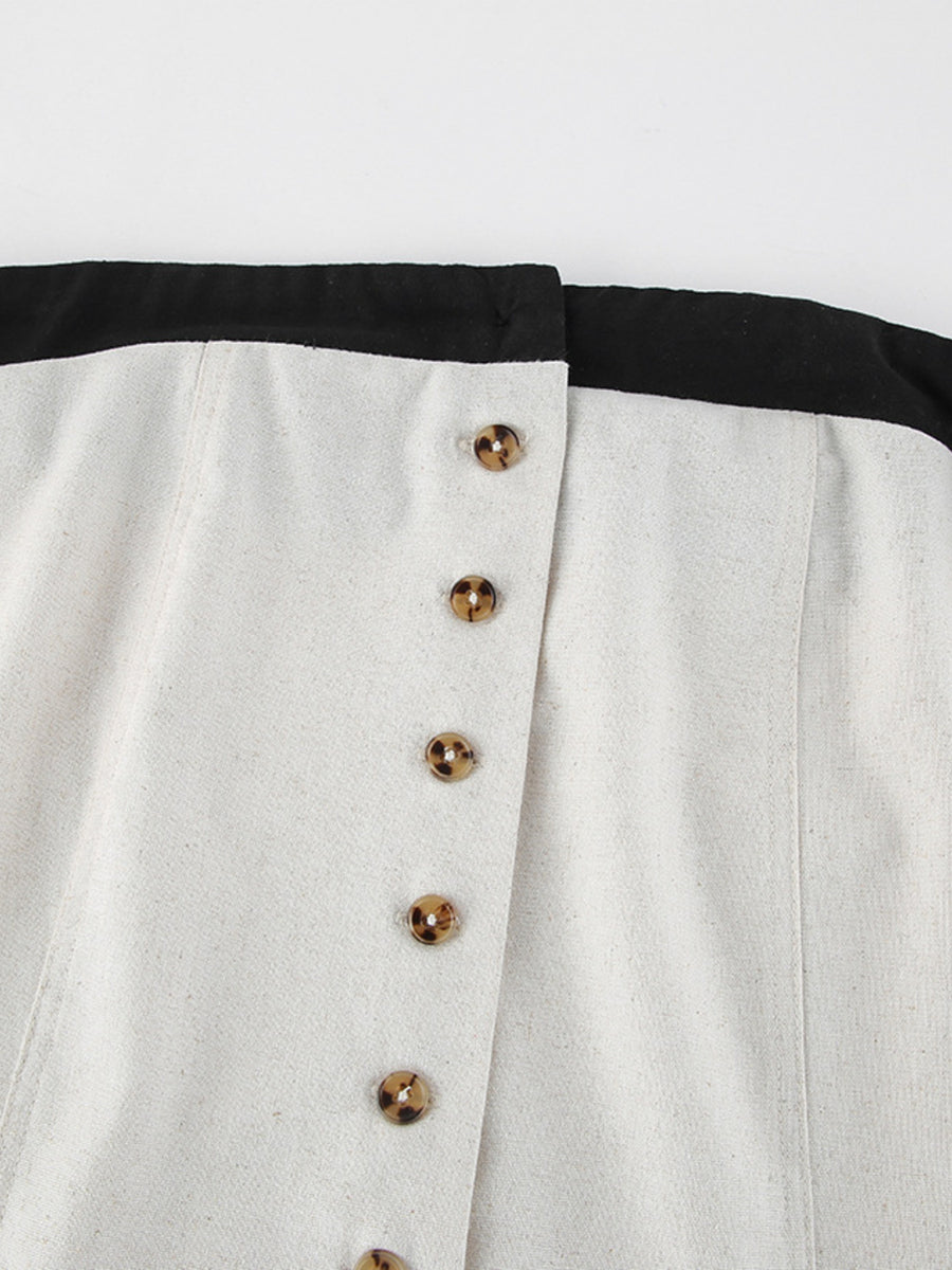 Button front tube maxi dress in beige cotton blend with tortoiseshell buttons and black trim.