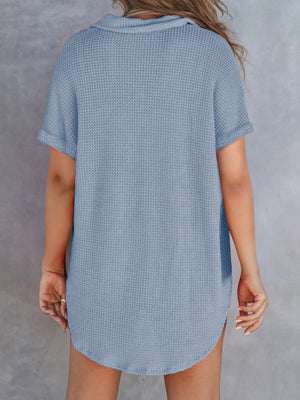 Waffle knit button-up shirt in light blue with short sleeves and a collared neckline.
