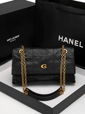 black shoulder bag with flap and geometric