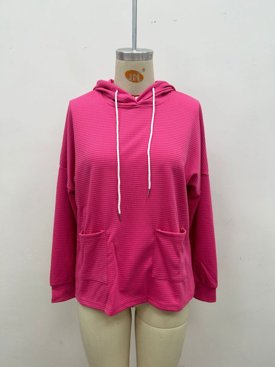 pullover hoodie featuring waffle knit in burnt orange with 100% polyester Care instructions: Machine wash cold texture