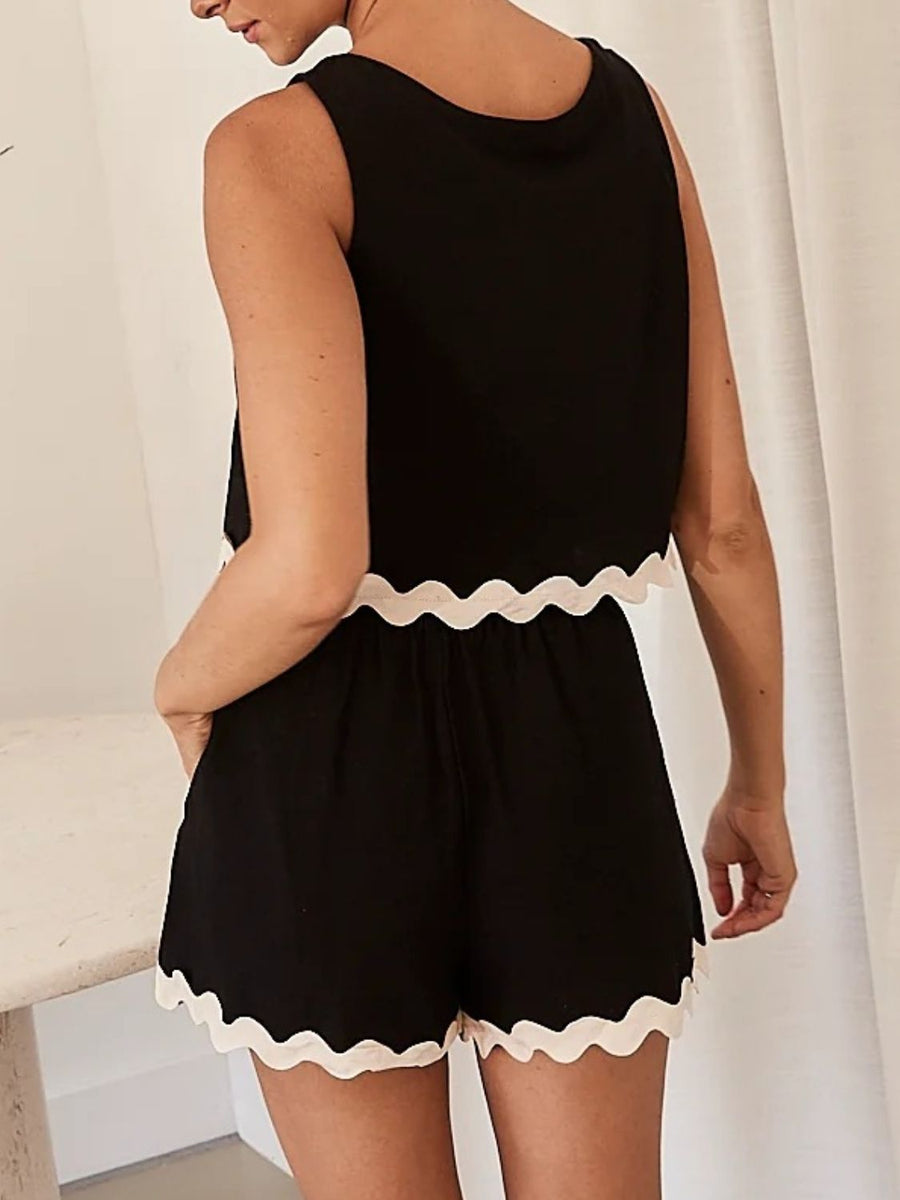 Black linen tank and shorts set with scalloped trim and a relaxed fit.