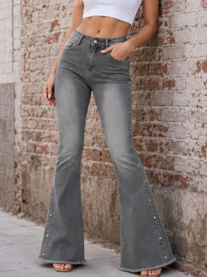 flare jeans in charcoal featuring raw hem and flared fit