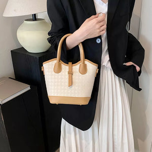 cream handbag with houndstooth and N/A