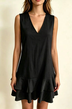 Black V-neck mini dress with tiered ruffle hem and sleeveless design.