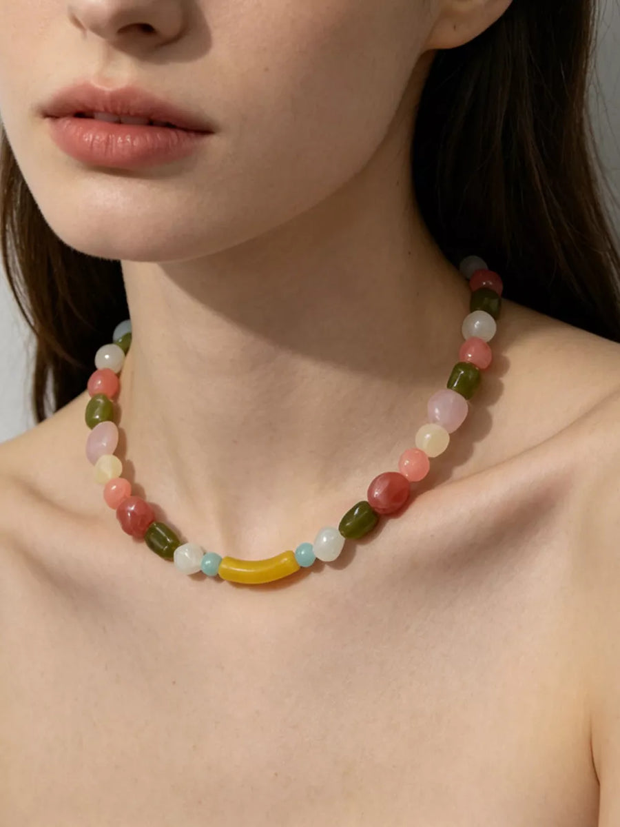 Acrylic Care instructions: 1 choker in light yellow with fitted silhouette