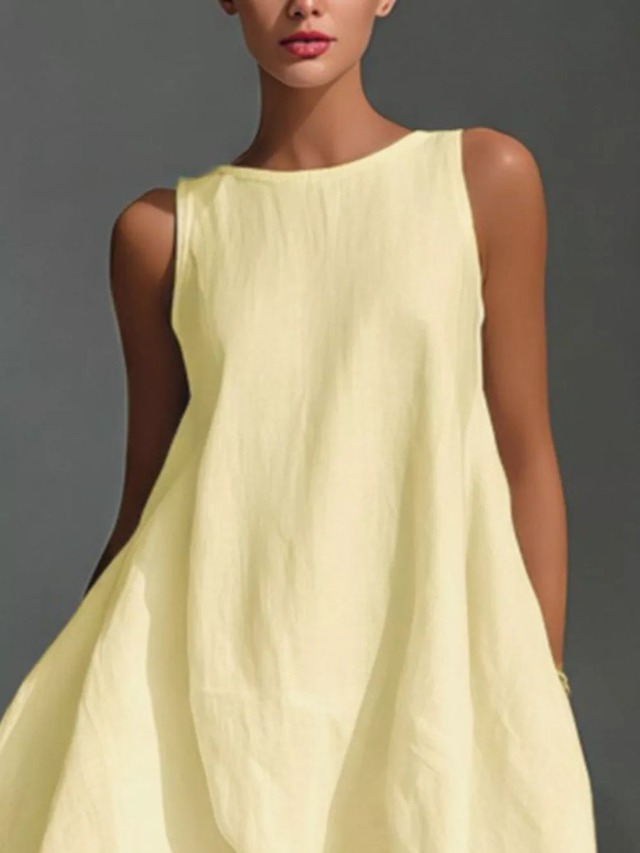 Asymmetrical sleeveless flowing dress in Pastel Yellow