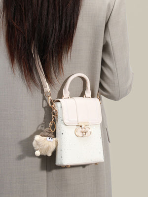 White crossbody bag featuring mini and star-print