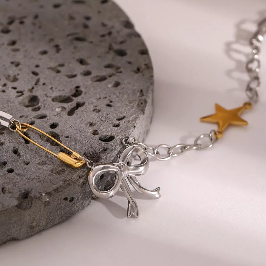 18K Gold-Plated, Stainless Steel Care instructions: Avoid wearing during exercis necklace in gold with layered silhouette