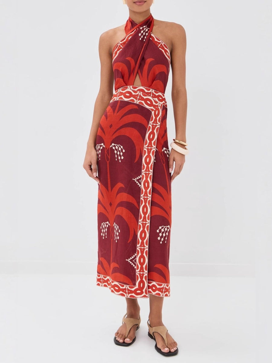 Tropical print halter neck dress with cutout and wrap skirt in red and white.