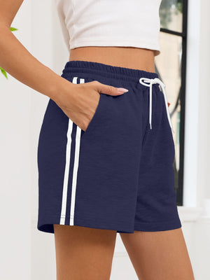 Navy jogger shorts with white side stripes and drawstring waist.