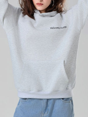 pullover hoodie in light gray featuring pocketed and relaxed fit