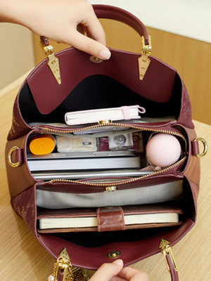 handbag in burgundy with top handles and medium