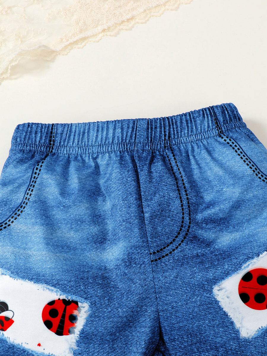 Baby denim-look shorts with ladybug print patches and elastic waistband.