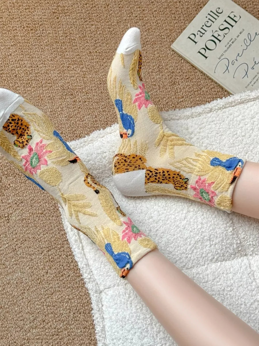 blue socks featuring knit and leopard-print, toucan, floral