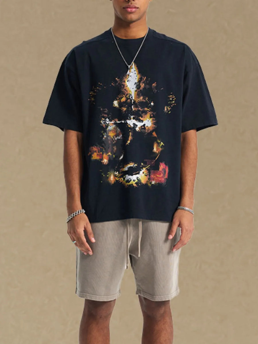 Black oversized t-shirt with abstract graphic print and crew neck.