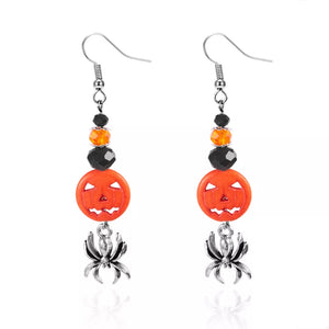earrings in orange with drop design and long