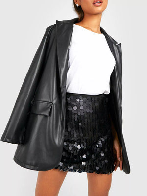 Women's black sequin mini skirt with all-over circular sequins.