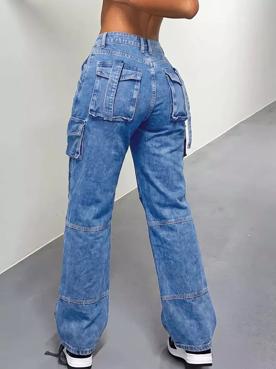 90% cotton, 10% polyester Care instructions: Machine wash cold cargo jeans in light wash blue with relaxed silhouette