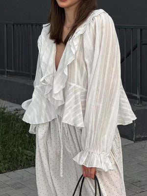 White blouse featuring frill and striped