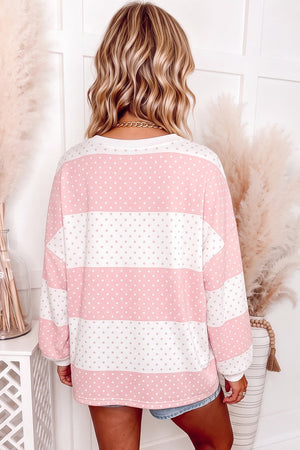ivory pullover sweater featuring stretch and color-block polka dot
