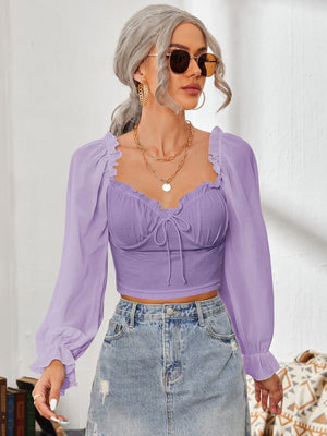 Purple bustier sleeve blouse with sweetheart neckline and tie front detail