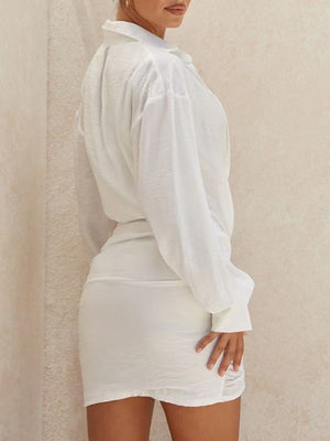white mini dress with asymmetrical and long sleeve
