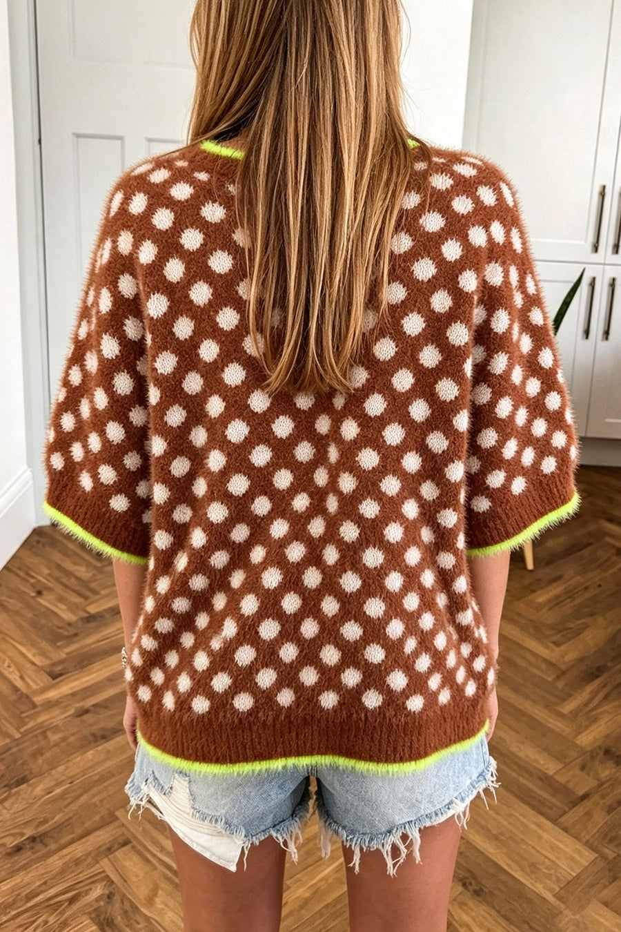 white pullover sweater featuring stretchy and polka dot